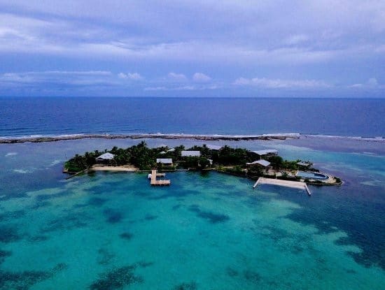 A small island with a boat in the middle of it