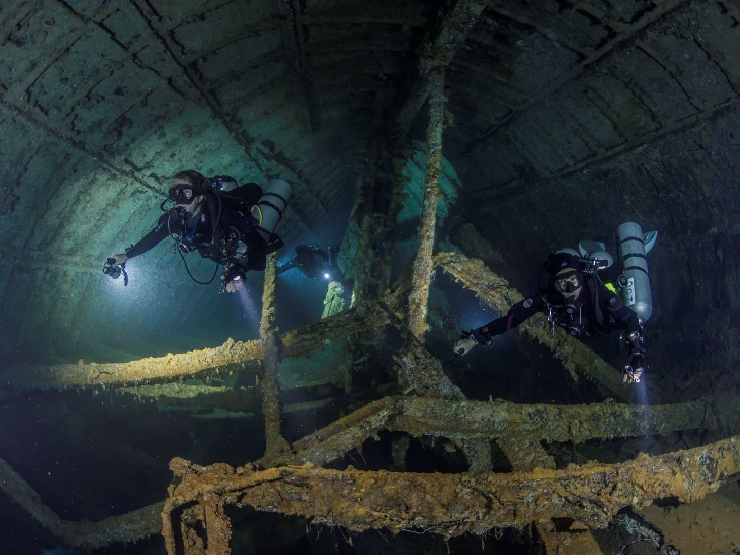 A group of scuba divers in the water.