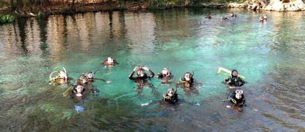 A group of people swimming in the water.