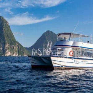 A boat in the water near some mountains