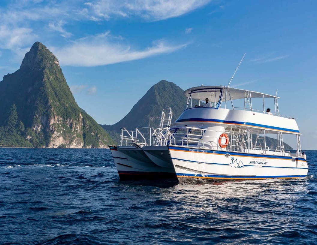 A boat in the water near some mountains