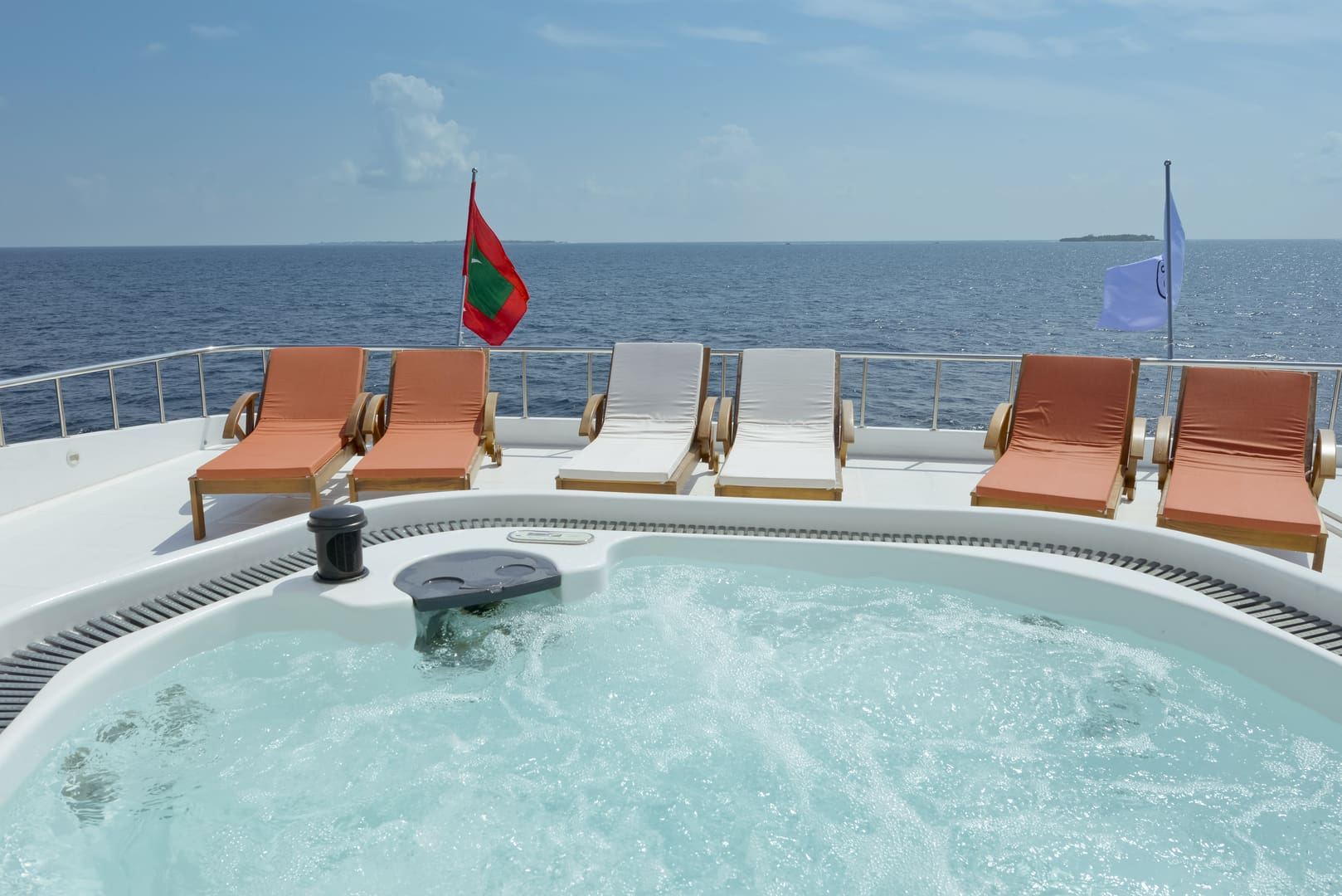 A hot tub on the deck of a boat.