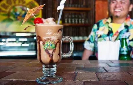 Chocolate and coffee milkshake with a cherry.