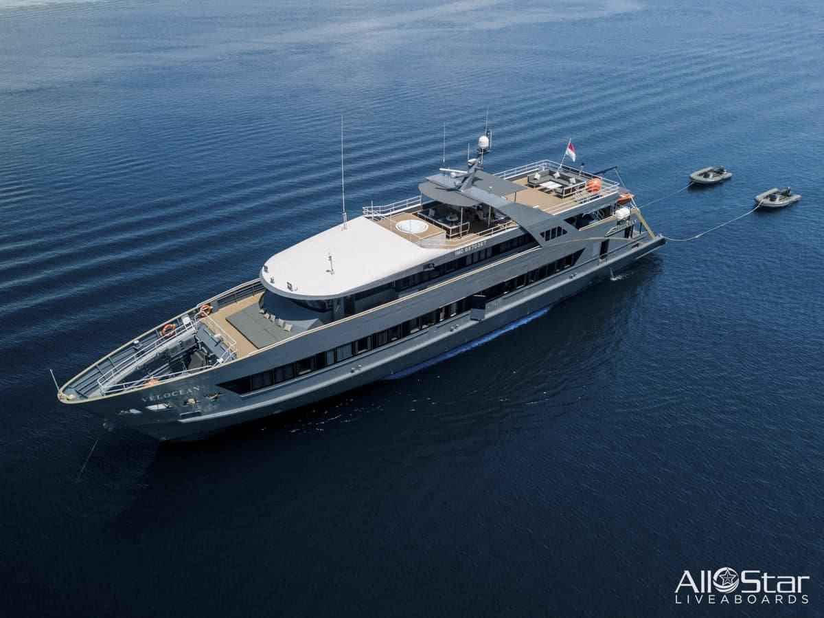 Aerial view of a luxury yacht in the ocean.