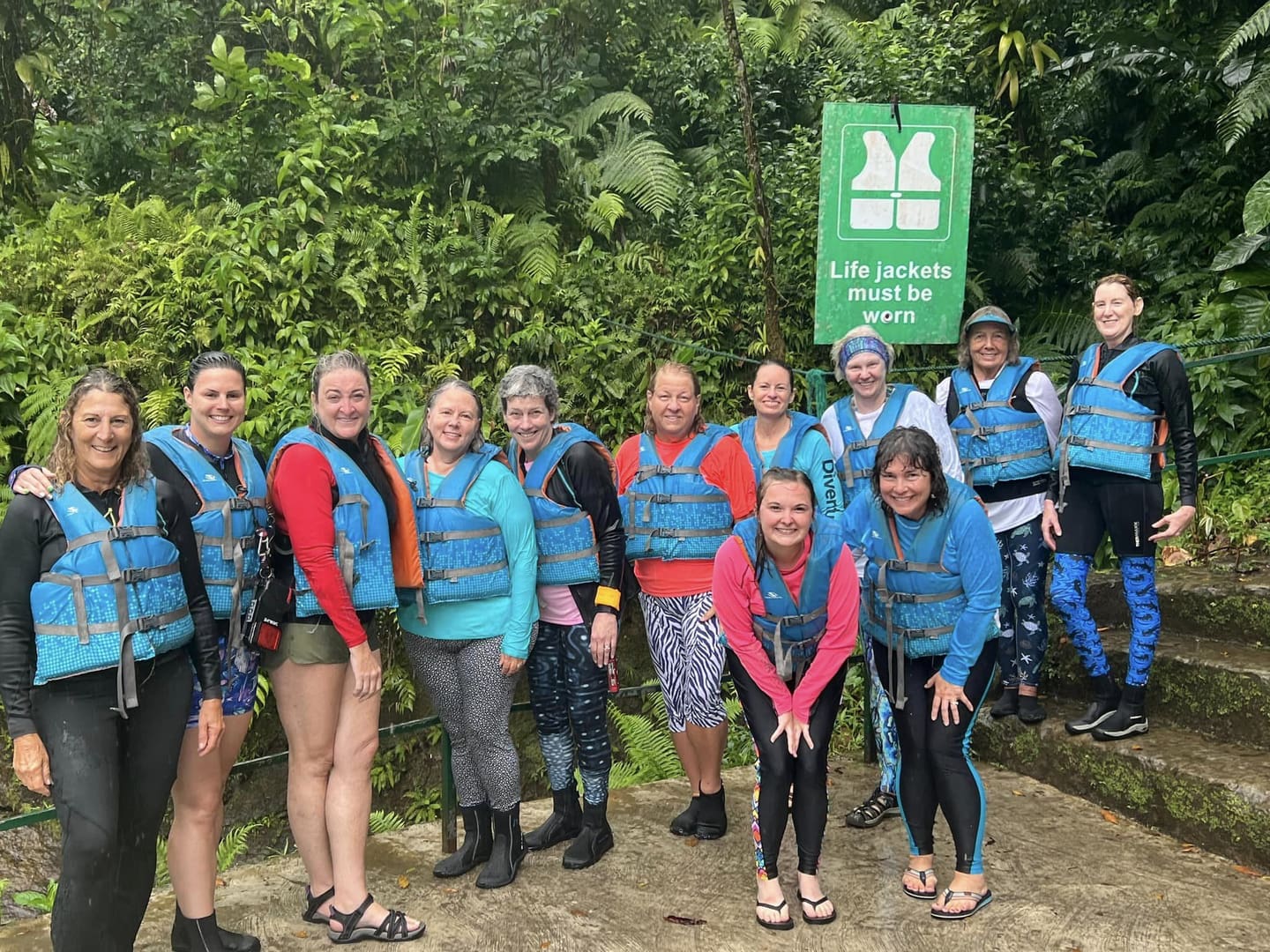 Group of women wearing life jackets.